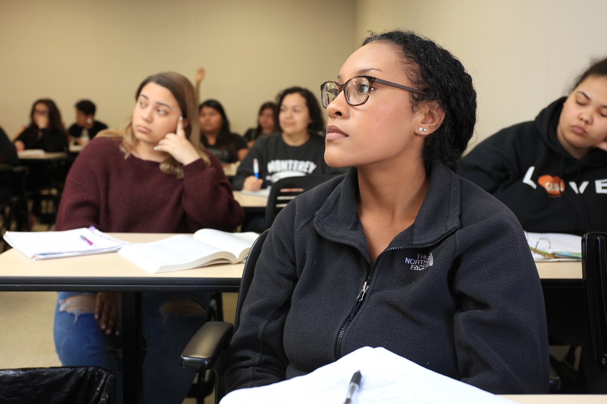 Female student listens in class