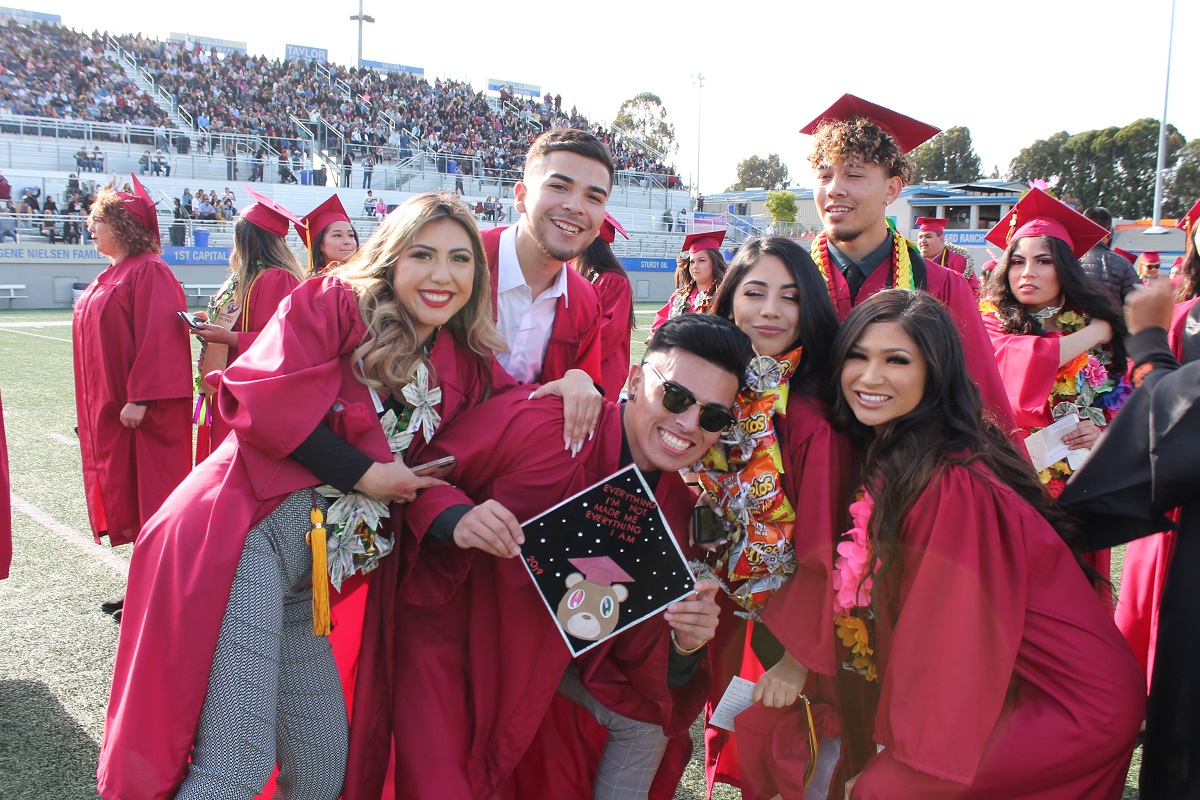 Graduates celebrate after Commencement